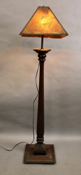 Vintage floor lamp with a patterned shade.