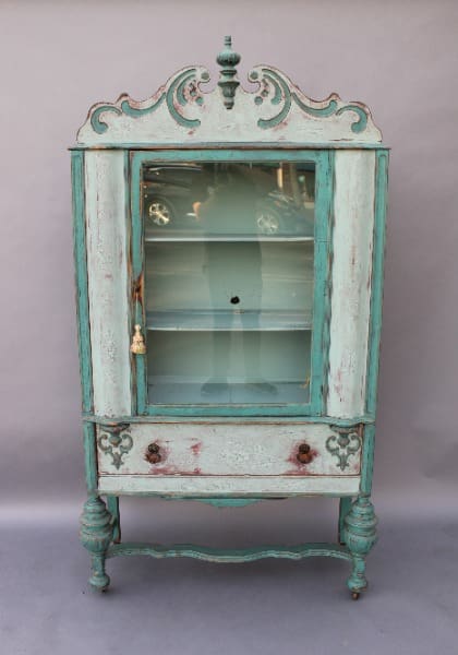 Antique wooden cabinet with glass doors.