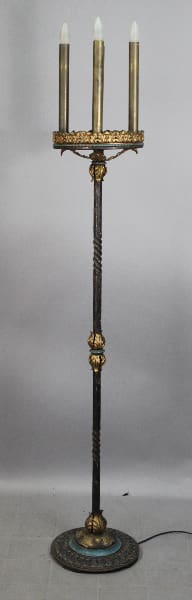 Ornate standing lamp with four candle lights.