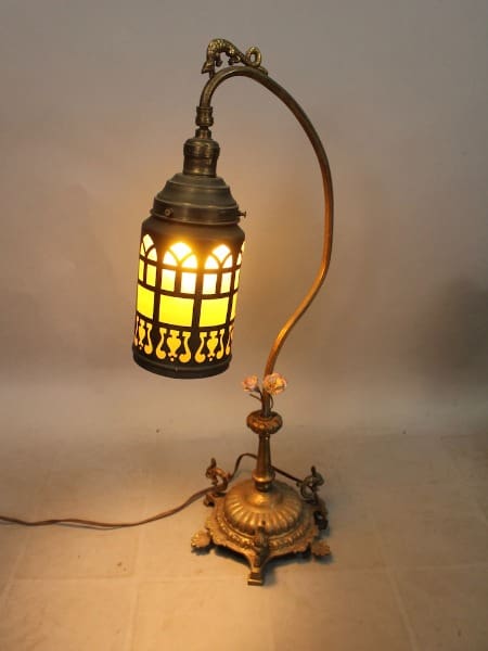 Vintage brass lamp with stained glass shade.