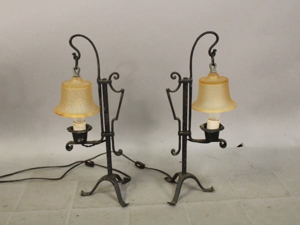 Two vintage metal lamps with orange shades.