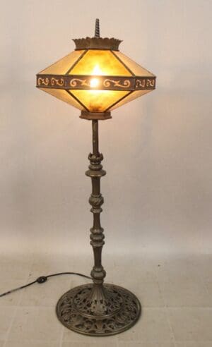 Ornate vintage lamp with glowing light.
