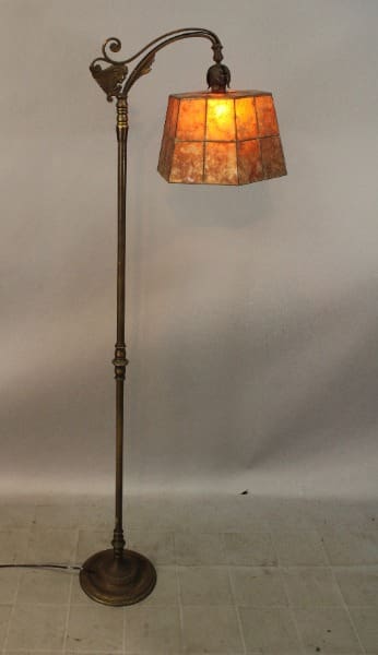 Antique floor lamp with stained glass shade.