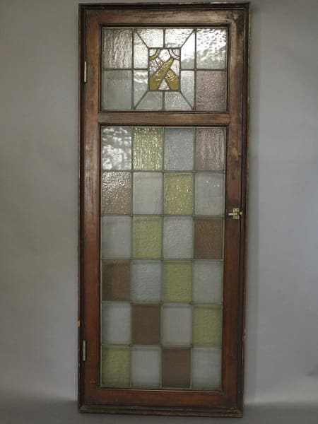 Wooden frame with stained glass window.