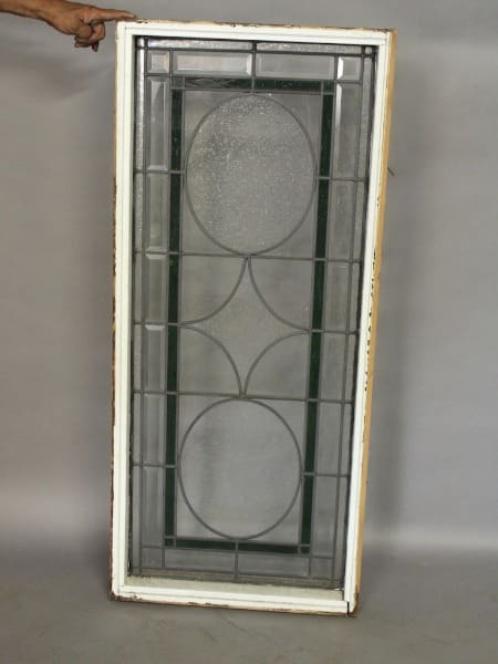 Rectangular framed decorative glass window panel.