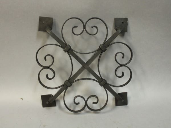Decorative wrought iron wall hanging design.