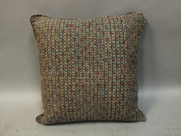 Colorful patterned square throw pillow.