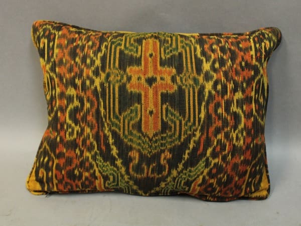 Colorful decorative pillow with intricate pattern.