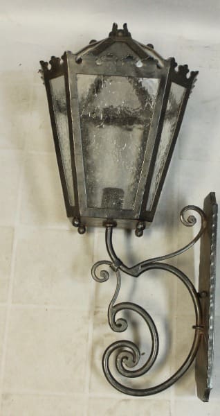 Vintage wrought iron wall lantern sconce.