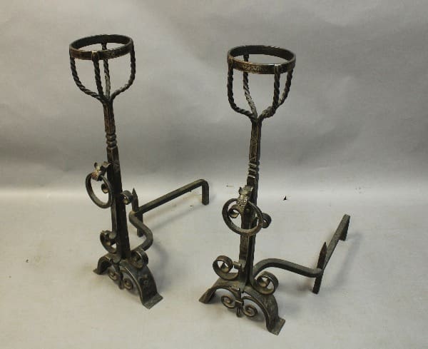 Two ornate wrought iron candle holders.