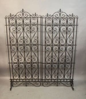 Ornate wrought iron decorative room divider.
