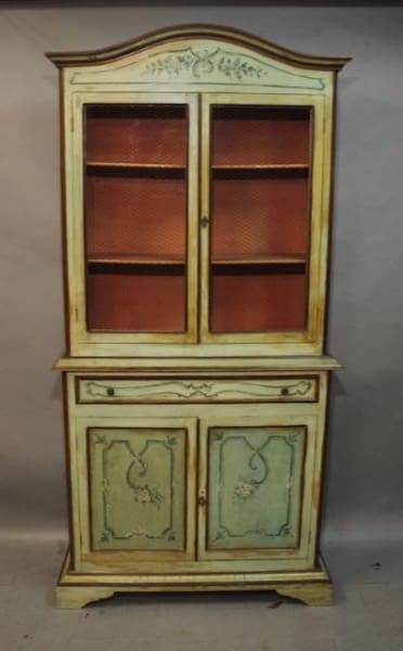 Vintage wooden cabinet with glass doors.