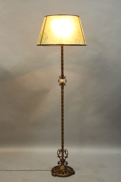 Ornate standing lamp with decorative base.