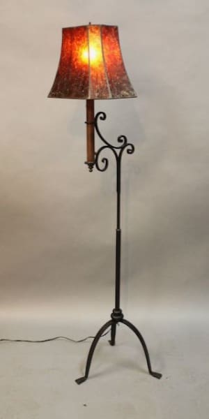 Vintage floor lamp with decorative shade.