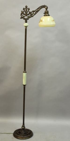 Vintage floor lamp with ornate design.