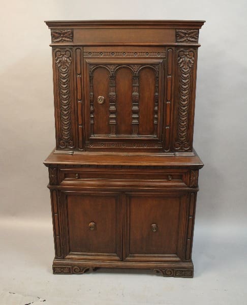Ornate wooden cabinet with intricate carvings.
