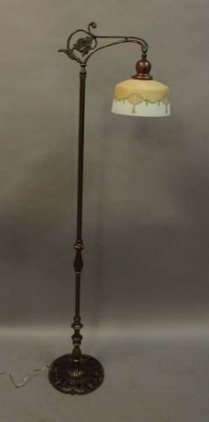 Vintage standing lamp with ornate design.