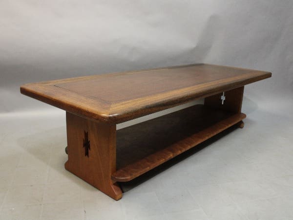 Wooden coffee table with lower shelf.