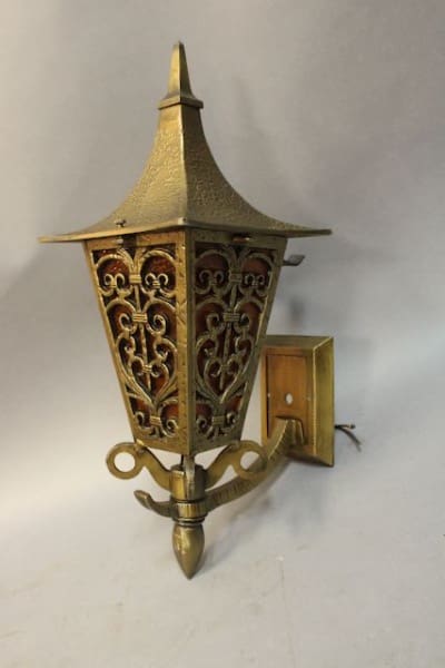 Ornate brass outdoor wall lantern fixture.