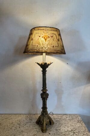 Ornate table lamp with decorative shade.
