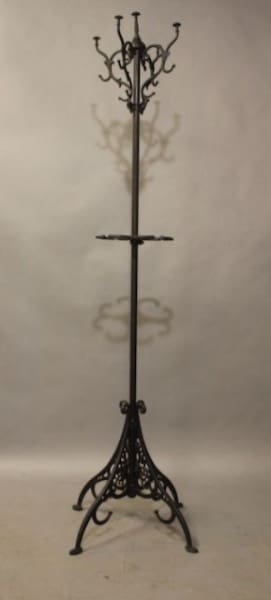 Ornate vintage metal coat rack stand.