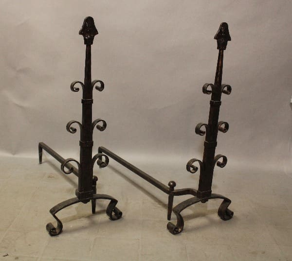 Decorative wrought iron fireplace andirons.