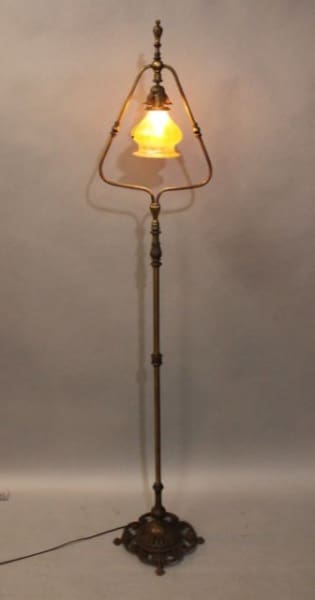 Antique standing lamp with glowing light.