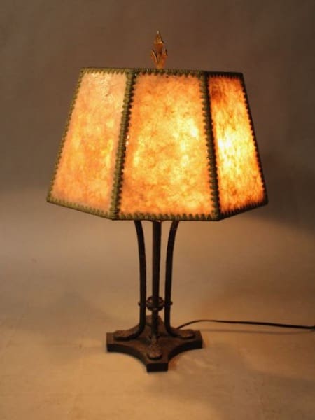 Vintage table lamp with glowing shade.