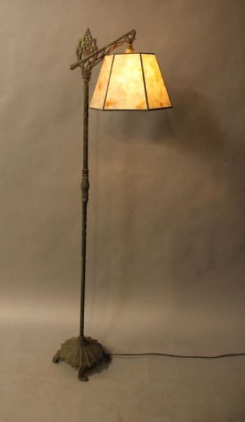 Vintage floor lamp with yellow lampshade.