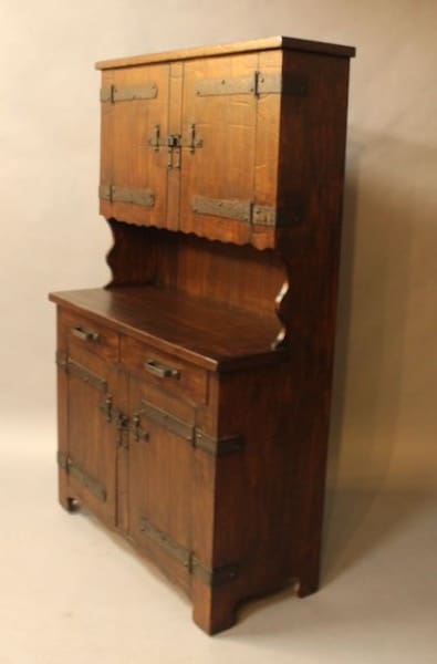 Wooden cabinet with metal hinges and handles.