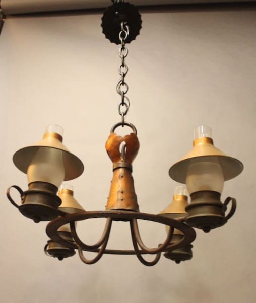 Vintage four-light metal chandelier with lampshades.