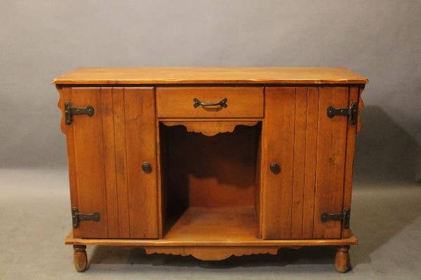 Wooden sideboard with open central shelf.