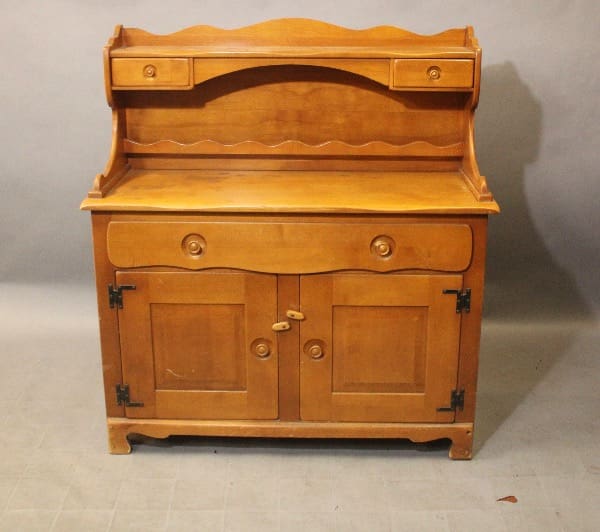 Wooden vintage cabinet with drawers and doors.