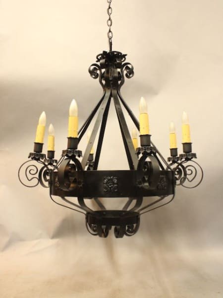 Elegant wrought iron chandelier with candles.