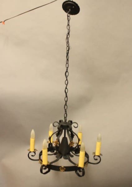 Black chandelier with candle-shaped lights.