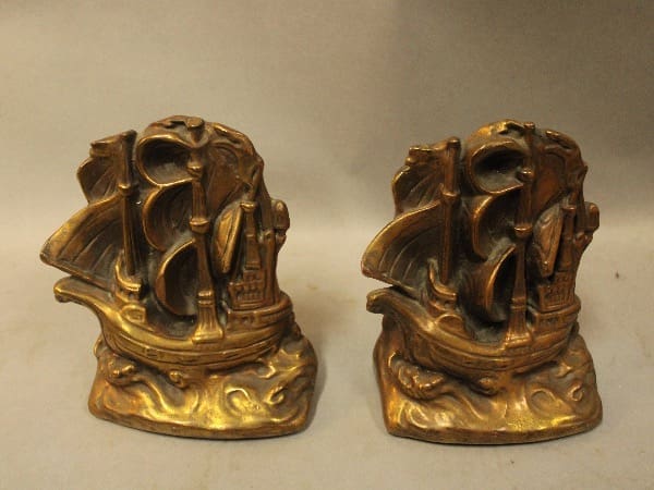 Bronze ship bookends on display.
