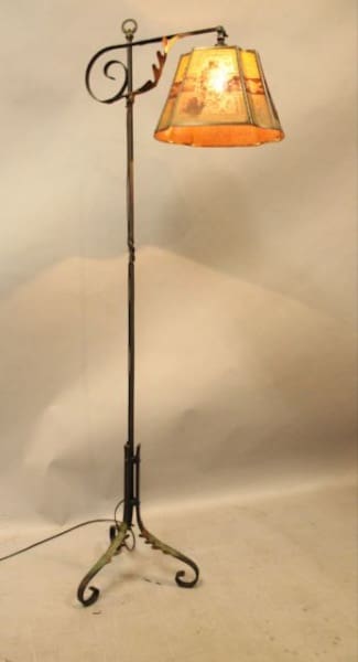 Vintage floor lamp with decorative shade.
