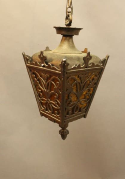 Ornate vintage hanging lantern with intricate design.