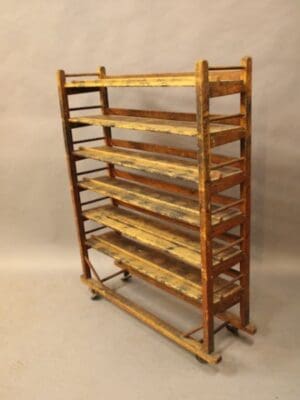 Wooden vintage bakery rack with multiple shelves.