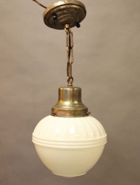 Vintage hanging lamp with white glass shade.