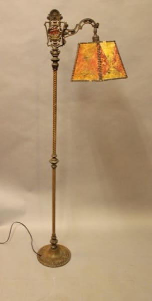 Antique floor lamp with ornate design.