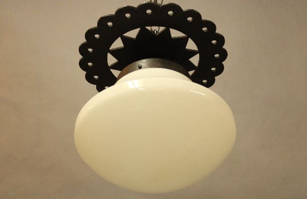 Ceiling light with decorative black trim.