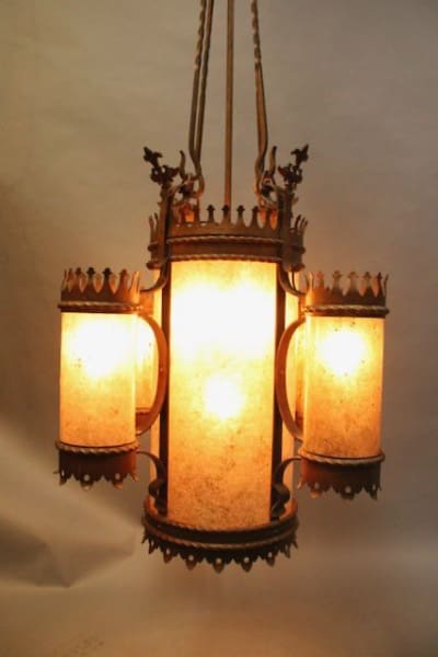 Ornate vintage chandelier with glowing lights.