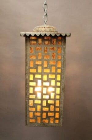 Hanging lantern with geometric patterned light.