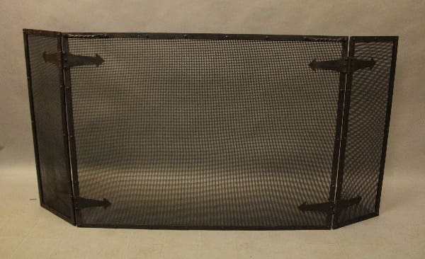 Black metal mesh fireplace screen with hinges.