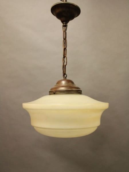 Vintage pendant light with chain and shade.