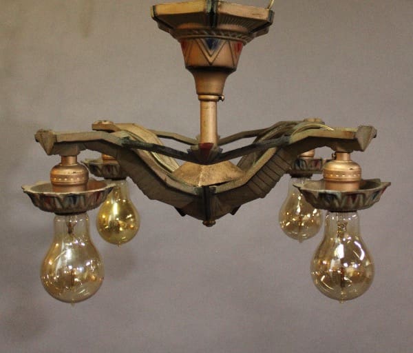 Vintage chandelier with exposed light bulbs.