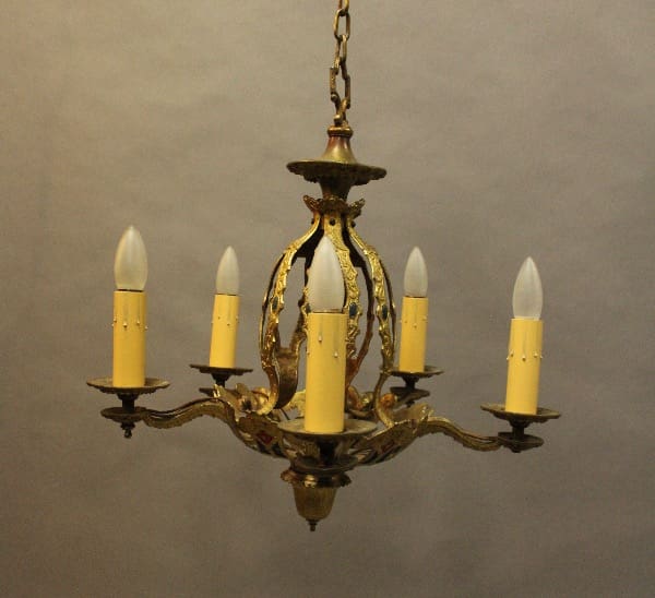 Antique brass chandelier with candle-style lights.