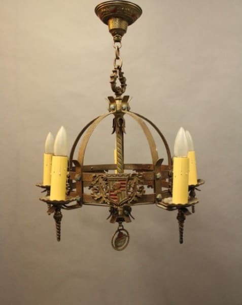 Vintage chandelier with candle-style lights.