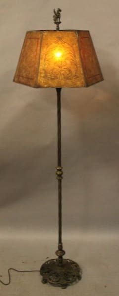 Vintage floor lamp with ornate lampshade.